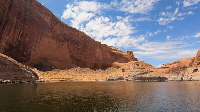 Lake Powell Utah rocky cliff shore from boat POV. Beautiful man made reservoir on Colorado River between Utah and Arizona. Vacation spot for boating and all outdoors recreation.
