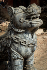 The statue of lion in the entrance to Rate Machhendranath Temple, Patan, Nepal