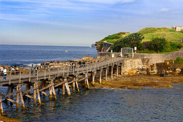 Fototapeta na wymiar Bare Island wooden bridge across water to Bare Island Fort