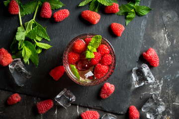 Old fashioned raspberry cocktail. Selective focus. Shallow depth of field.
