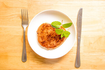 A fine steak dinner on a wood-grain table