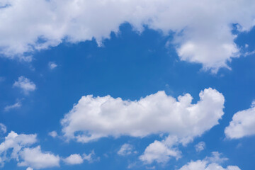 Obraz premium blue sky background with white clouds concept