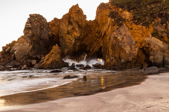 Sunset on Keyhole Arch aka Pfeiffer Beach Arch at Pfeiffer Beach,Pfeiffer Big Sur State Park, Big Sur, California, USA