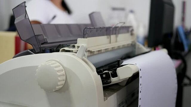 closeup of continuous printer in the office.