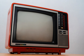 Vintage TV set isolated. Retro television - Old vintage red television, retro technology. Ancient tv concept