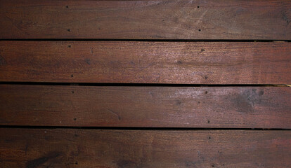 The dark brown color of wood background