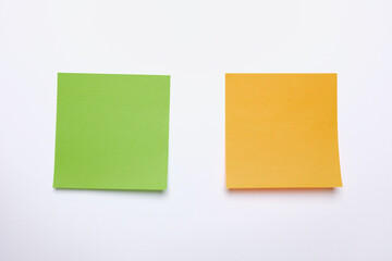 Obraz na płótnie Canvas Two yellow sticky notes reminders on a white background