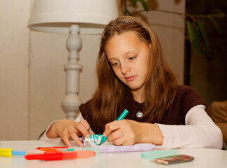 little girl painting at home