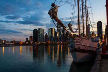Tall Ship and the Downtown Skyline Across Chicago Harbor at Night, Chicago, Illinois, USA