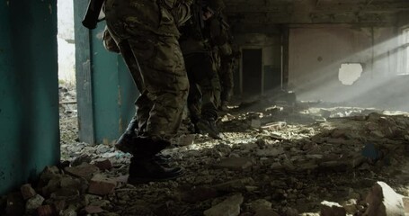 Special Forces soldier in combat uniforms aiming gun - Powered by Adobe