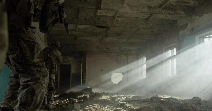 Special Forces soldier in combat uniforms aiming gun