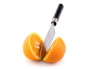 orange cut with a kitchen knife on a white background horizontal view