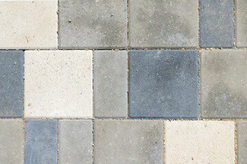 Paving slabs, top view. Texture of paved tiles. Stone floor.