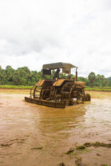 Tractor preparing land with seedbed cultivator as part of pre seeding activities in early spring season of agricultural works at farmlands.