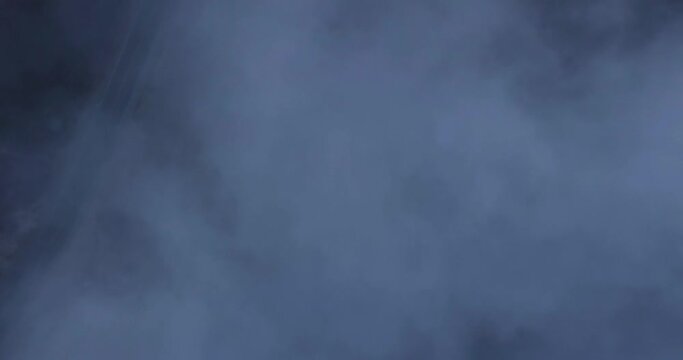 Foggy mountain with highway road covered by a misty sea of clouds. Shot from above in 4k by drone.