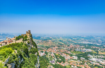 Beautiful panoramic view of  San Marino with the Guaita tower on the peak of Monte Titano - obrazy, fototapety, plakaty