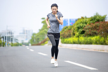 Young women run for fitness in the morning