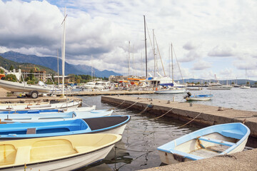 Fototapeta premium Boats on the water. View of Bay of Kotor near Tivat city. Montenegro, Adriatic Sea