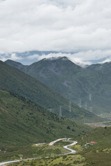 The high voltage electric transmission tower on top of mountains in Tibet, China