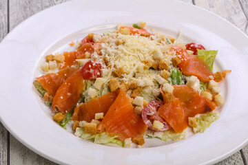 Caesar salad with salmon and parmesan