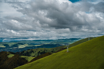 The high voltage electric transmission towers on mountains in Tibet, China.