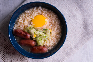 ramen with egg yolk and Japanese hotdog
