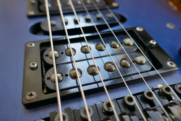 Strings on an electric guitar.