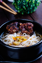 spicy fried pork spareribs with thick rice noodles soup