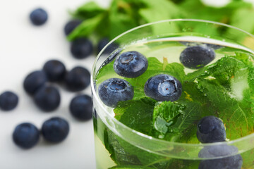 lemonade summer drink with berries and blueberries and mint with lime