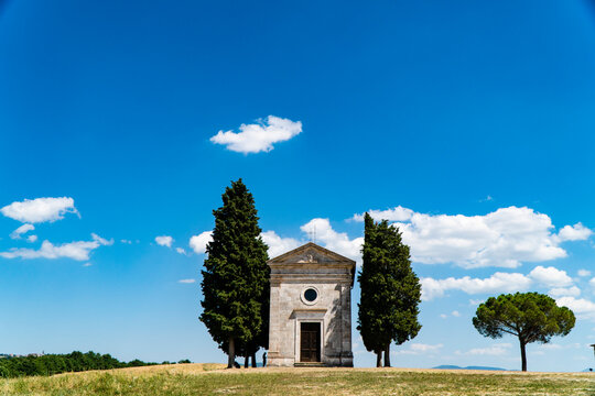 Tuscany landscape with a old little chapel of Madonna di Vitaleta, San Quirico d'Orcia, Italy