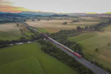 Express passenger train from Prague to Rijeka on its way over the Ljubljana marshes in early...