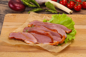 Sliced smoked duck breast served salad