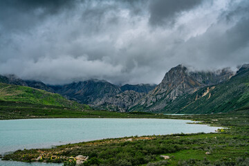Fototapeta na wymiar The Twin lake in Tibet, China, on a cloudy day, summer time.