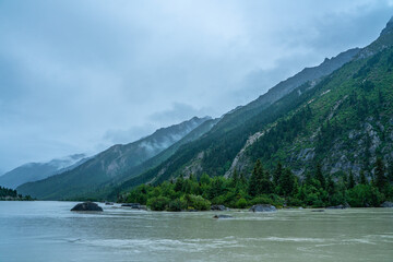 Obraz premium Ranwu lake, a sacred lake in Tibet, on cloudy day, summer time.
