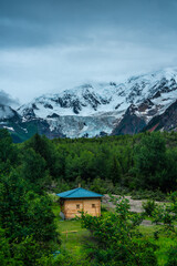 Midui Glacier, a big glacier on mountains in Tibet, China, on summer time, on a cloudy day.