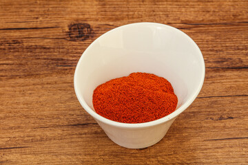 Obraz na płótnie Canvas Dry paprika powder in the bowl