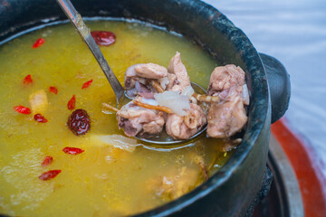 Stone pot chicken, a traditional Tibetan dish.