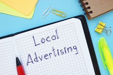 Business concept about Local Advertising with phrase on the piece of paper.