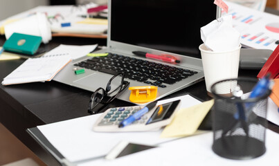 Messy and cluttered desk