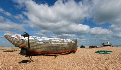 Abandoned fishing boat on the shingle beach at Dungeness in Kent.