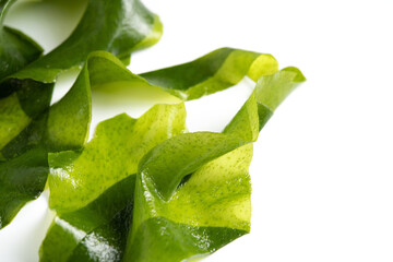 Fresh seaweed wakame isolated on white background. Japanese food © Nikox2