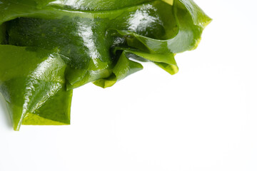 Fresh seaweed wakame isolated on white background. Japanese food © Nikox2