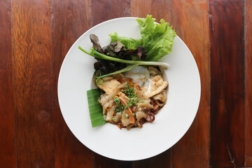 stir fried noodles with pork and fried egg