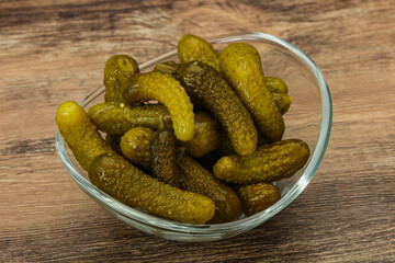Pickled gherkin in the bowl