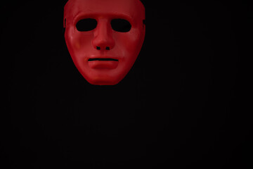 Scary looking mask against black background