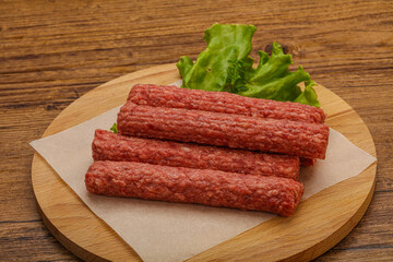 Raw beef sausages with spices