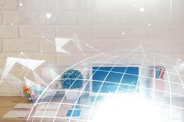 Obraz premium Double exposure of desktop with computer and world map hologram. International data network concept.