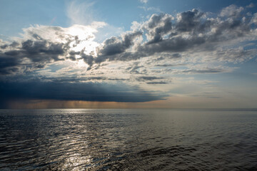 Fototapeta premium Clouds before the rain in the sea