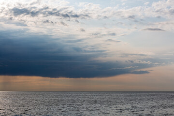 Fototapeta na wymiar Clouds before the rain in the sea