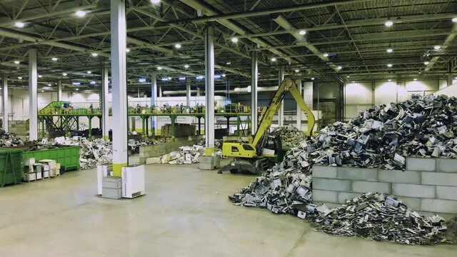 Recycling center with disposed trash. Plastic trash at garbage recycling factory.